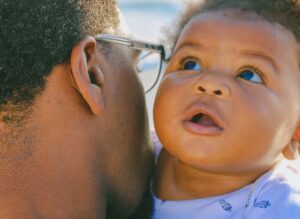 father holding baby son